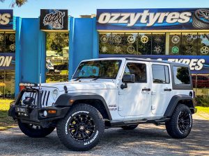 Jeep wrangler sport on hussla ambush matte black 1 of 4